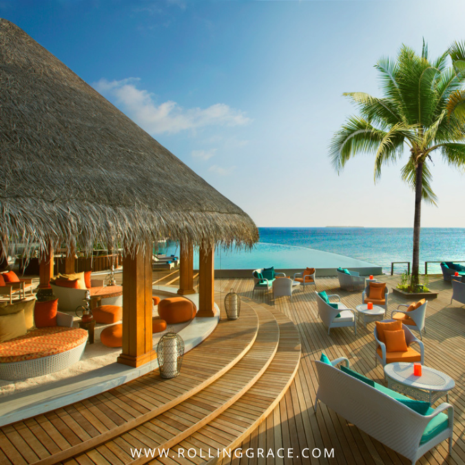 Beachfront sand bar dining area at Dusit Thani Maldives with ocean views in Baa Atoll
