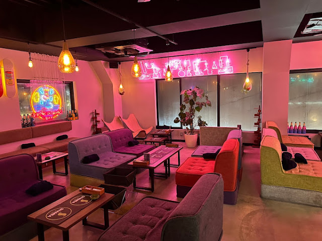 Colourful lounge interior at Shisha Cafe and Bar PukuPuku Osaka with hookah service