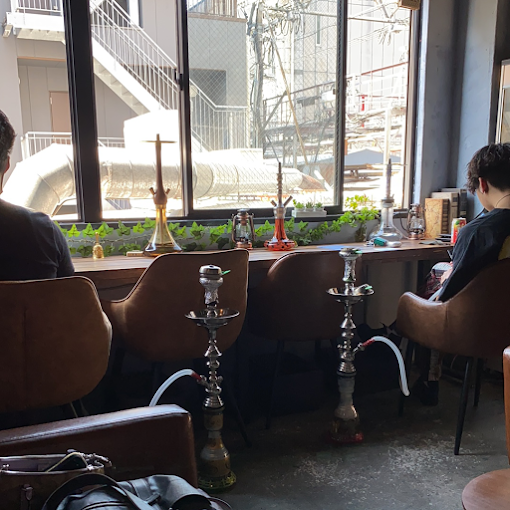 Shisha at Shisha Cafe Fumus Osaka with hookahs set inside a modern lounge space