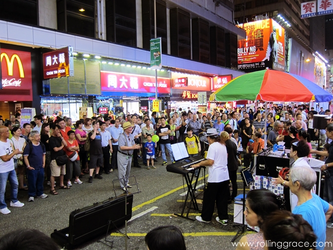Street performers performing at night on Sai Yeung Choi Street