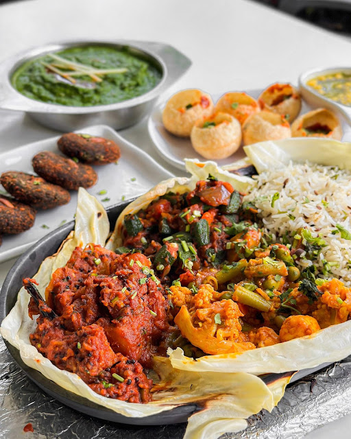 Indian vegetarian buffet at The Ganga Cafe in Kuala Lumpur with curries, vegetables, and traditional plant-based dishes