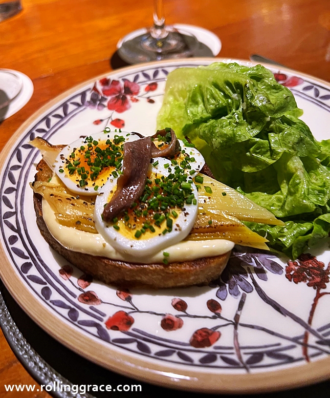 Nancy’s Caesar with soft-boiled egg, leeks and anchovy crostini at Osteria Mozza Singapore