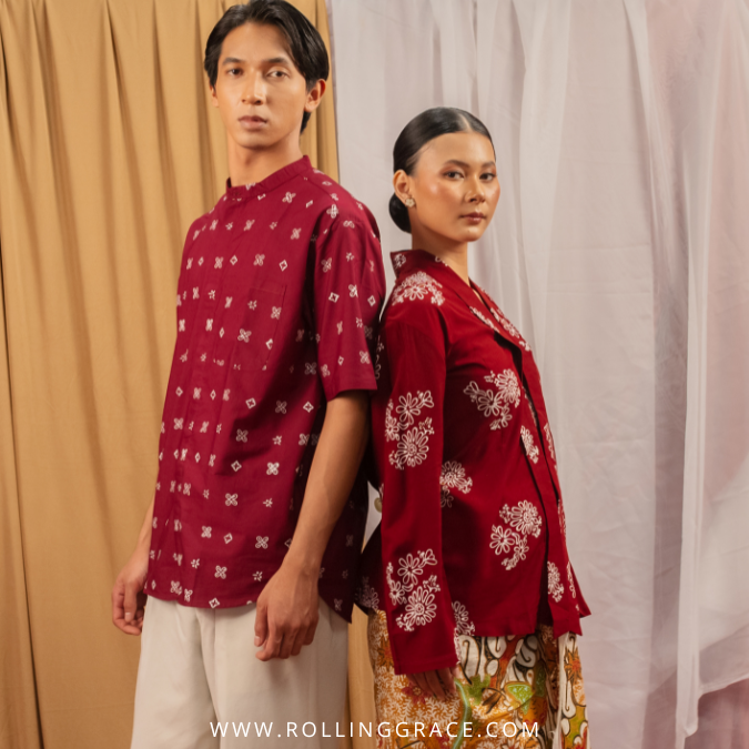 Man and woman in traditional Malaysian batik outfits, dressing etiquette in Malaysia