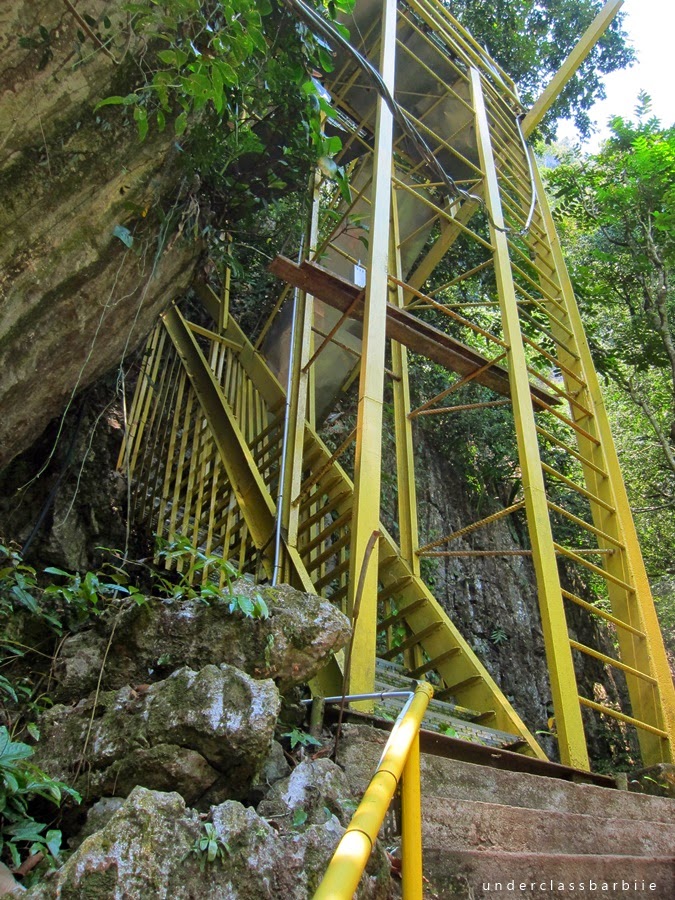 Metal stairs leading to the entrance of Gua Charas cave in Panching