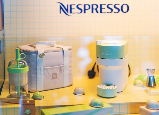 Limited-edition Nespresso summer accessories including Vertuo Pop machine, tumblers, and barista tools
