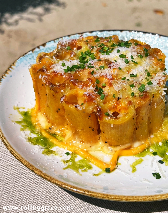 Main dish from +Twelve Sentosa featuring a plated brunch-style item with rich textures and garnish