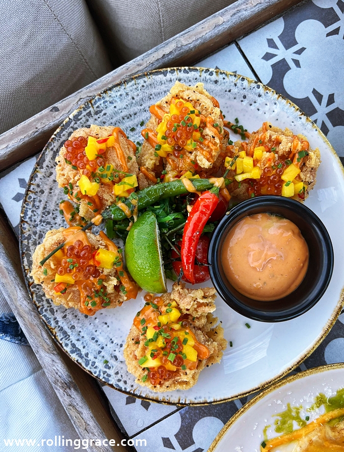 Signature dishes served at +Twelve beach club in Sentosa, Singapore, popular with day guests and weekend crowds