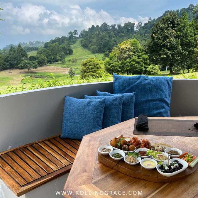 Outdoor seating area at The Fat Frog Langkawi with views of the surrounding greenery