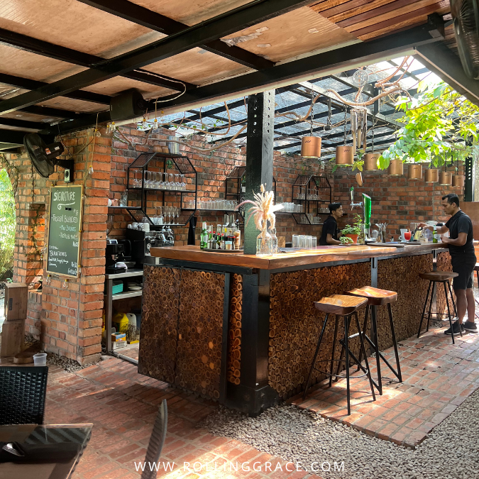 Interior dining area at The Fat Frog restaurant Langkawi with rustic wooden furnishings
