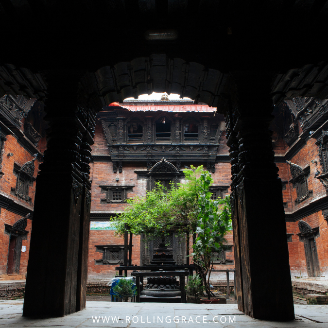 Top 10 Attractions in Kathmandu: A Cultural Journey in Nepal 7 Courtyard view through carved wooden doorway at Kumari Temple in Kathmandu