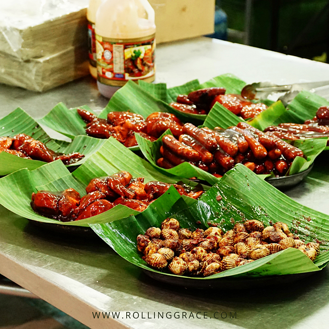 Grilled meats and snacks served on banana leaves at Tamu Kianggeh Brunei