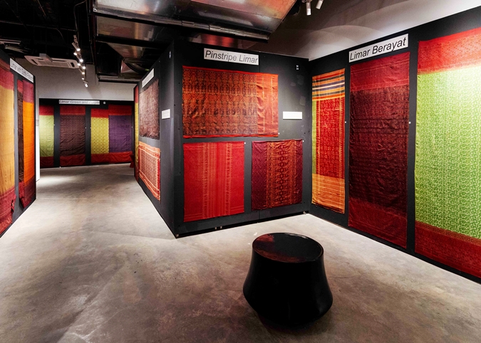 Rows of colourful limar and songket textiles on display at John Ang exhibition Kuala Lumpur
