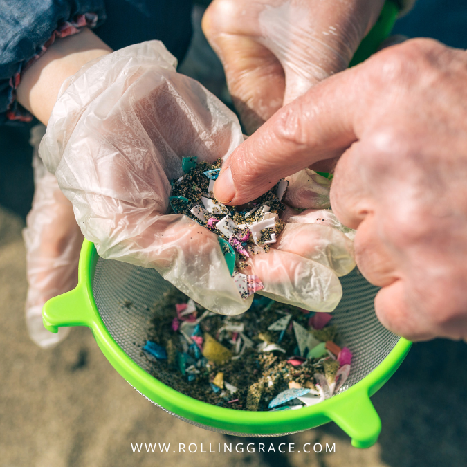 Gloved hands washing microplastics from food in a colander, microplastics in Malaysia