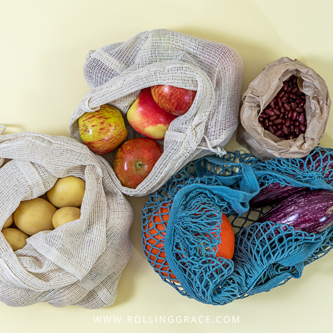 Reusable mesh and fabric bags filled with fresh produce as non plastic alternatives