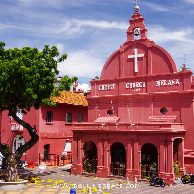 Historic Melaka town with red colonial buildings and church facade