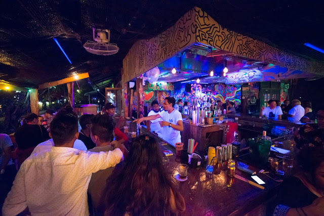 Crowded night scene at One Love Langkawi with live music and shisha lounge vibes