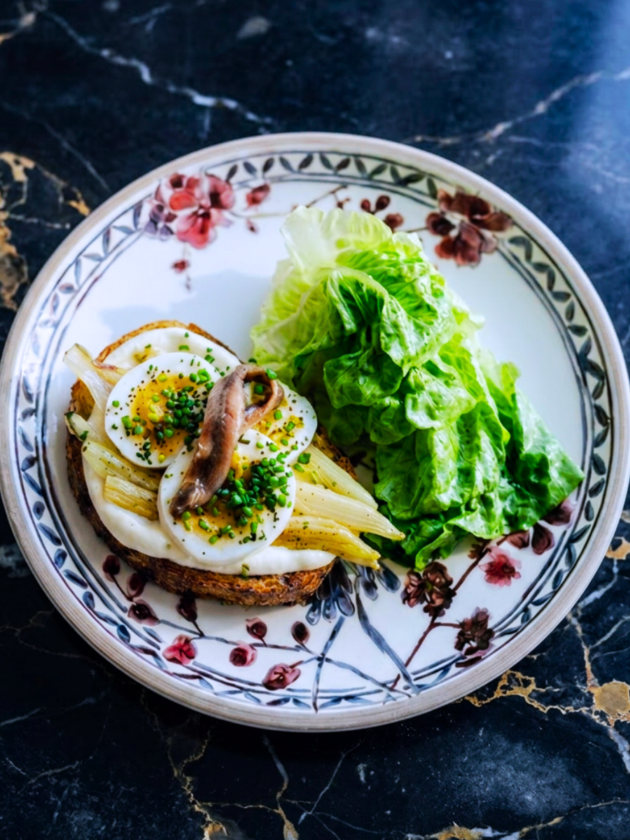 Nancy's Caesar with soft-boiled egg, braised leeks and anchovy crostini at Osteria Mozza Singapore