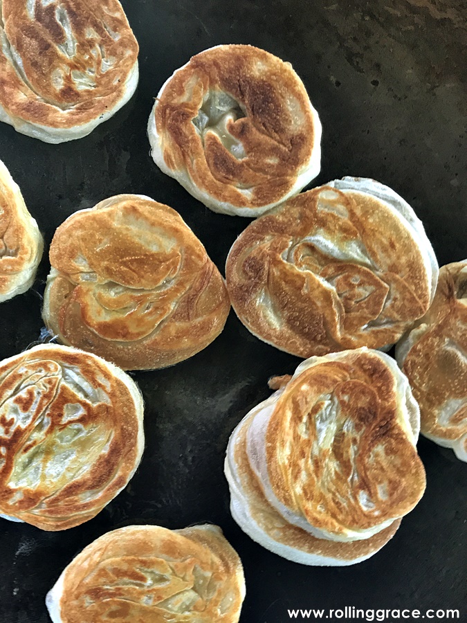 Best Ramadan Food in Malaysia: 10 Must-Eat Bazaar Favourites 14 Roti bom frying on a flat pan at a Ramadan bazaar
