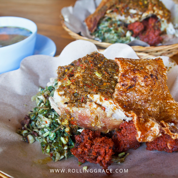 Babi guling Bali — roasted pork plate with crispy skin, lawar, and spiced rice at a Balinese warung