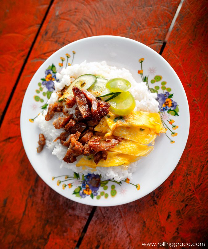 Charcoal-grilled pork steaks with steamed rice, the Cambodian breakfast dish Bai Sach Chrouk