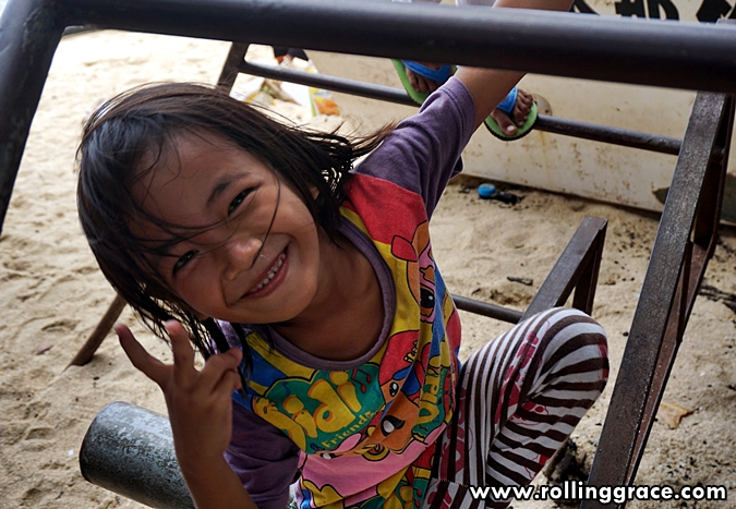 Young Bajau Laut child smiling at Kampung Mabul village on Pulau Mabul, Sabah