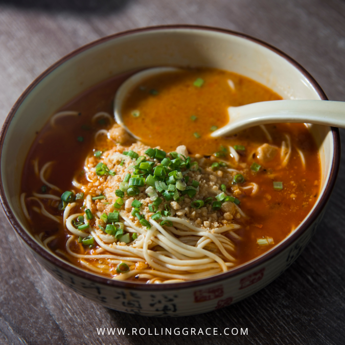 Dan Dan Mian noodles in spicy chilli oil broth with minced pork and scallions in Chengdu, Sichuan