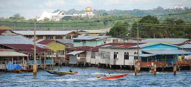 Istana Nurul Iman palace Brunei seen from the river with gold dome and wide facade