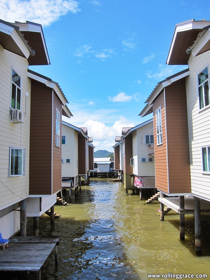 Kampung Ayer water village Brunei with modern stilt houses lining a river channel