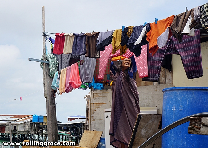 Colourful laundry hanging outside stilt houses at Kampung Mabul, Pulau Mabul, Sabah