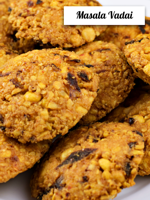 Masala vadai lentil fritters piled on a plate, Sri Lankan street food