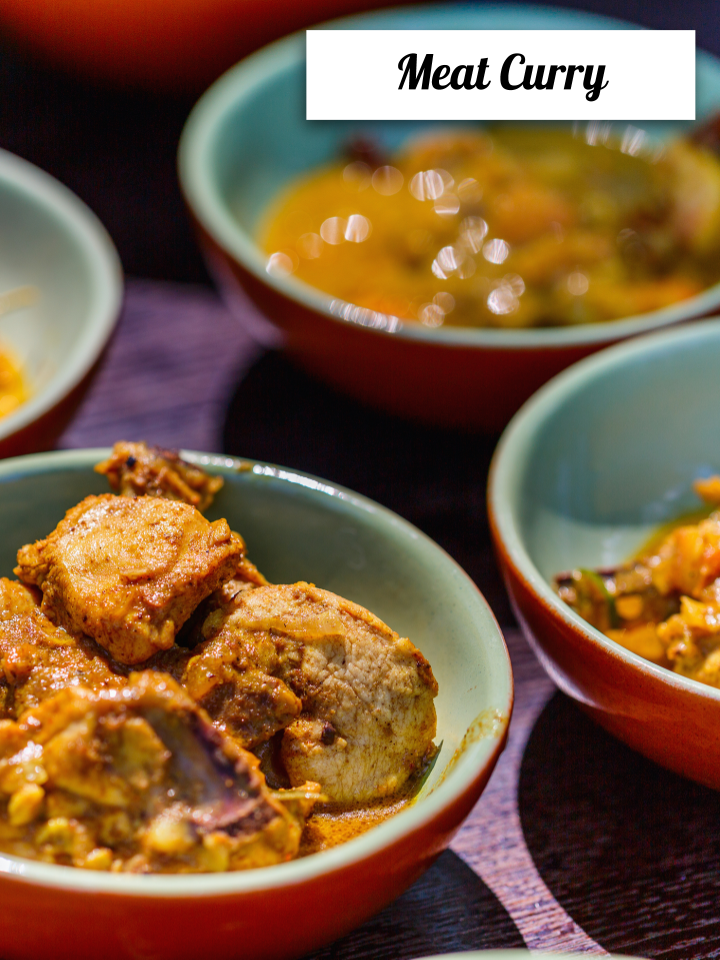 Sri Lankan meat curry in small bowls with rich gravy