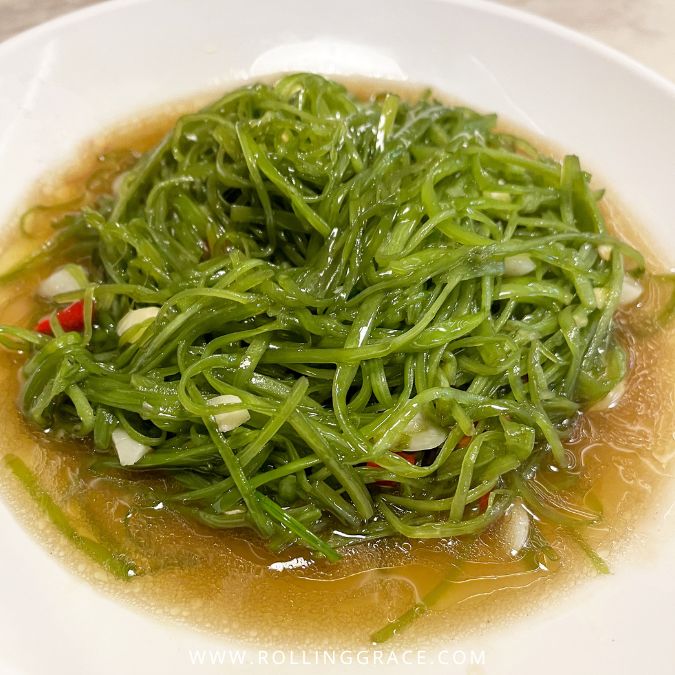 Stir-fried morning glory with garlic and oyster sauce, a vegetable side dish served across Cambodia