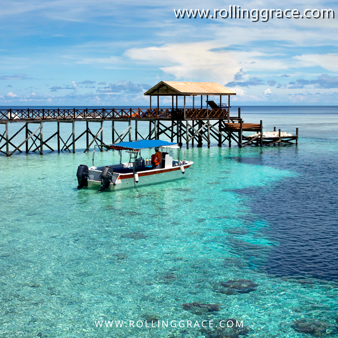 10 Most Beautiful Islands in Sabah Malaysia You Must Visit 2 Pulau Sipadan Sabah jetty over clear turquoise water with a boat moored alongside