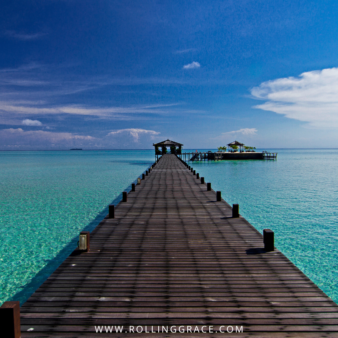 10 Most Beautiful Islands in Sabah Malaysia You Must Visit 6 Wooden jetty extending over crystal clear turquoise water at Sipadan Kapalai Island Sabah