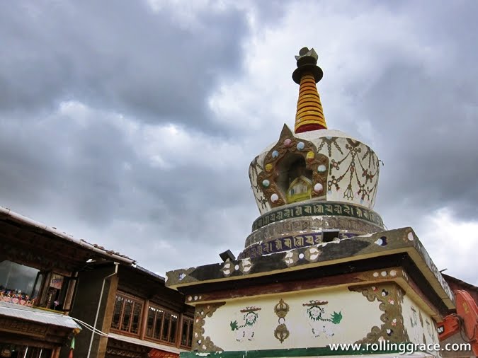 How to Be an Ethical Traveller: 5 Ways to Make a Difference 5 Tibetan stupa against a cloudy sky, respecting religious sites in Asia while travelling