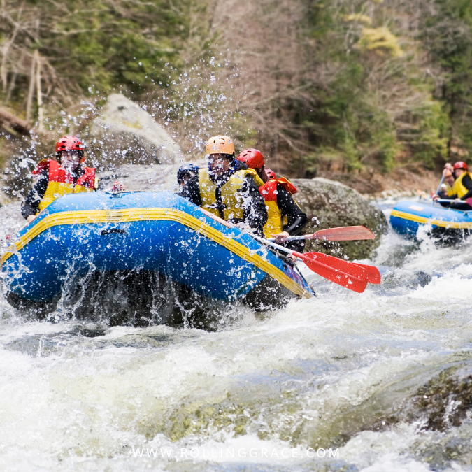 Rafters in blue raft tackling rapids near Kuala Kubu Bharu, Selangor, Malaysia