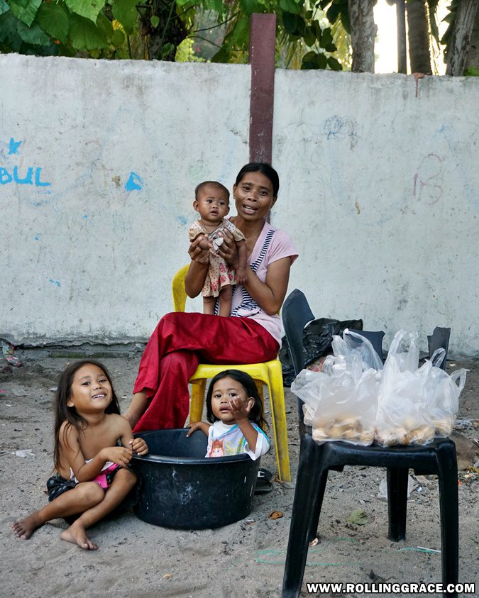 Bajau Laut mother and young child seated at Pulau Mabul Sabah Malaysia