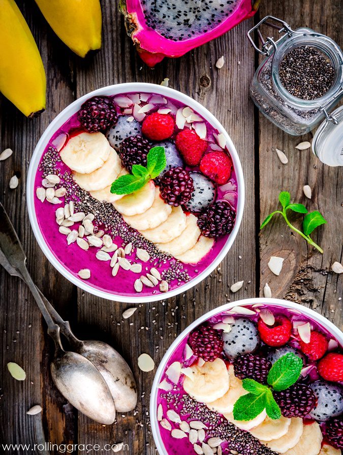 Thick blueberry smoothie bowl topped with sliced banana, berries, and chia seeds is one of the Ways to Eat Chia Seeds
