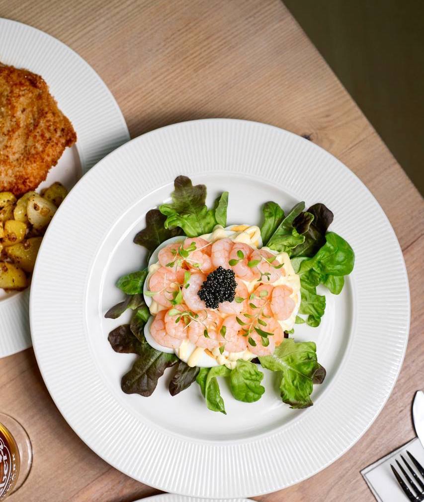 8 Best Empire Damansara Food Spots for Serious Flavours 3 Authentic Danish open-faced smørrebrød and pork schnitzel on a plate at DenHygge cafe