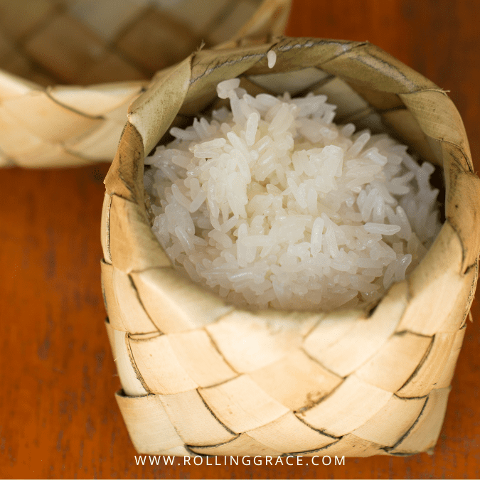 Overhead view of perfectly cooked sticky rice in a bamboo steamer basket lined with cloth