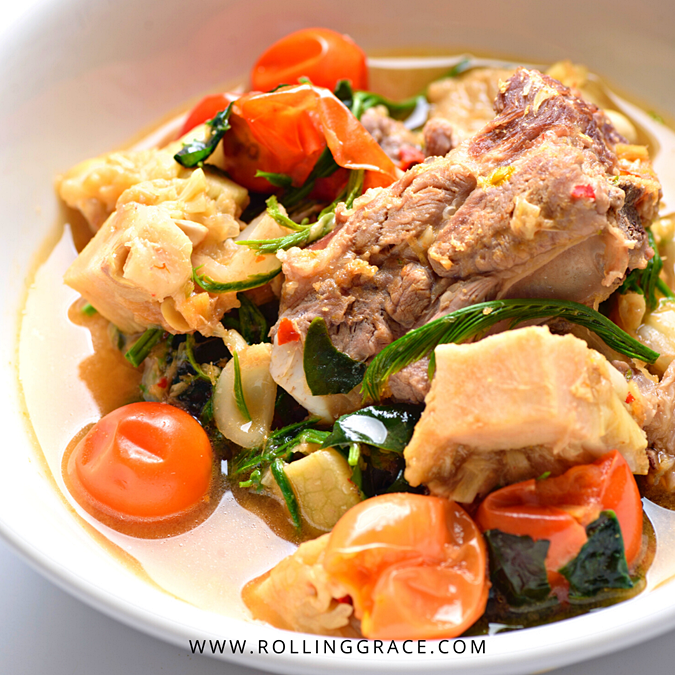 Bowl of kaeng khanun, a northern Thai green jackfruit curry with pork and cherry tomatoes