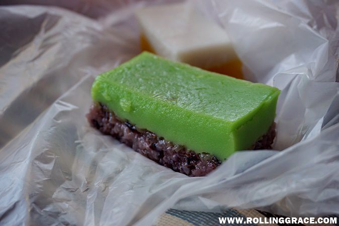 A piece of green layered kuih at Nat Pokok Getah morning market in