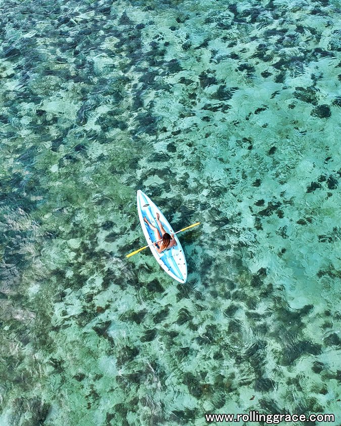 10 Best Things to Do in Mabul Island, Sabah You Must Try 6 Aerial view of a kayaker on the coral reef at Pulau Mabul, Sabah, Malaysia