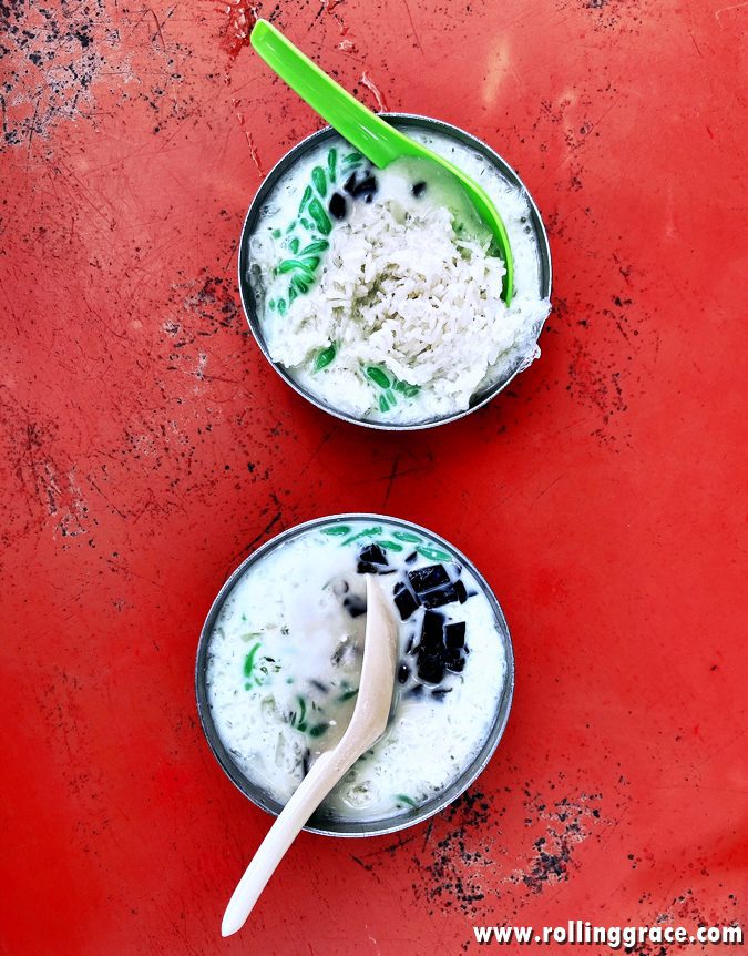 Bowl of Penang cendol with shaved ice, green rice flour jelly, coconut milk, and gula Melaka syrup