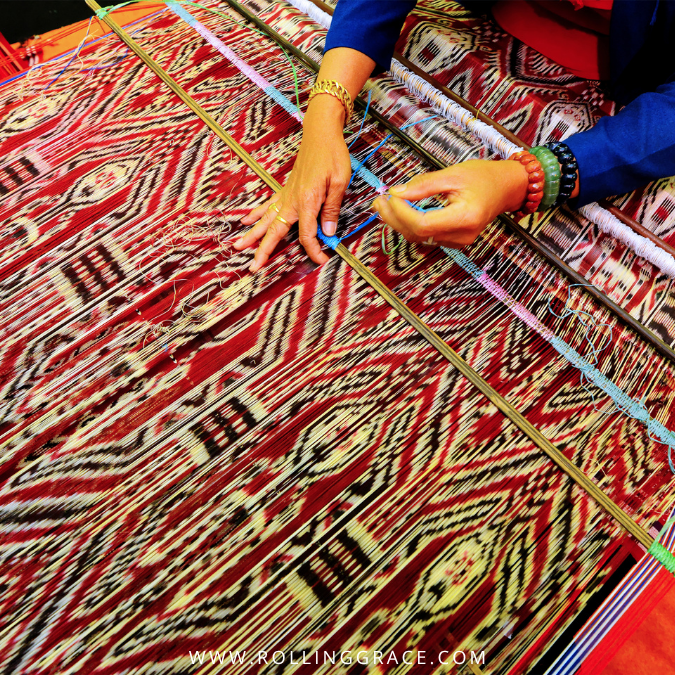 Colourful traditional woven textiles from Sarawak displayed at a market stall, Borneo