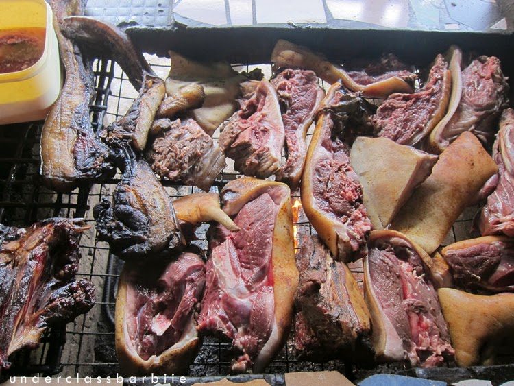 Large quantity of smoked wild boar Sinalau Bakas piled at a market stall in Sabah Malaysia