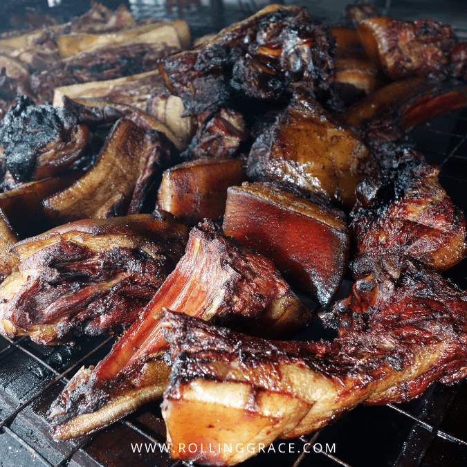 Freshly grilled Sinalau Bakas wild boar meat on open grill, Sabah Malaysia