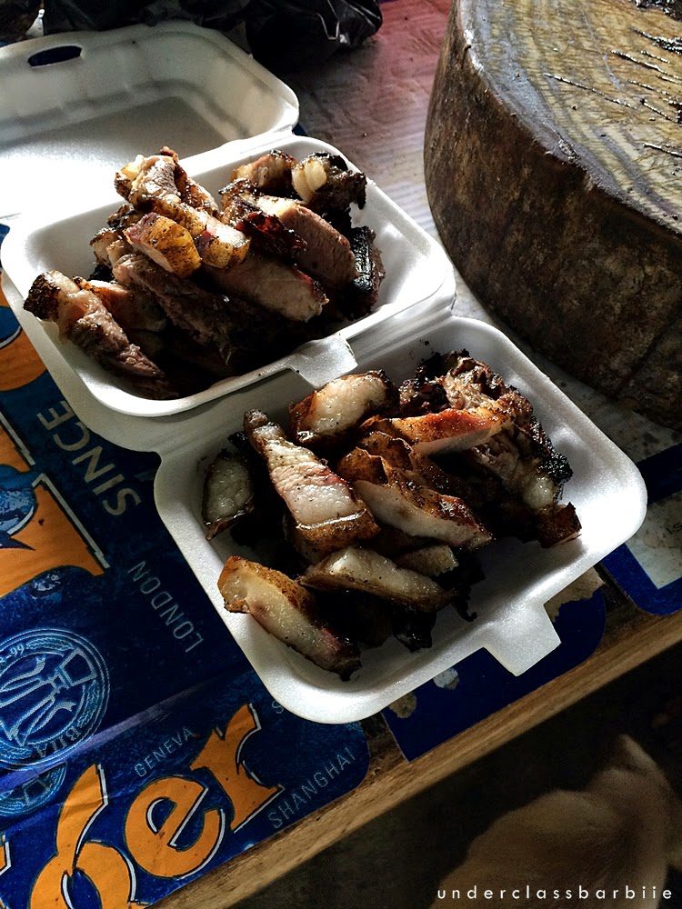 Portions of Sinalau Bakas smoked wild boar served in a takeaway container, Sabah Malaysia
