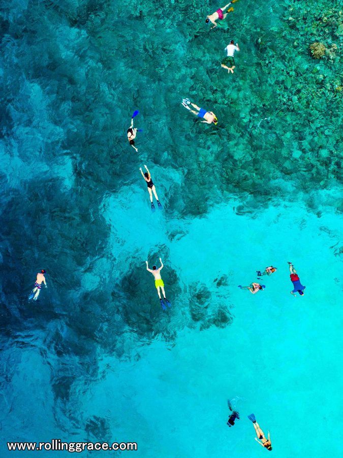 10 Best Things to Do in Mabul Island, Sabah You Must Try 5 Aerial view of snorkellers in turquoise water at Pulau Mabul, Sabah, Malaysia