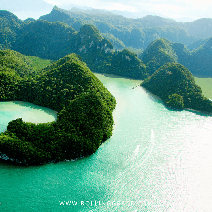 Aerial view of Tasik Dayang Bunting surrounded by forested hills, Langkawi, Malaysia